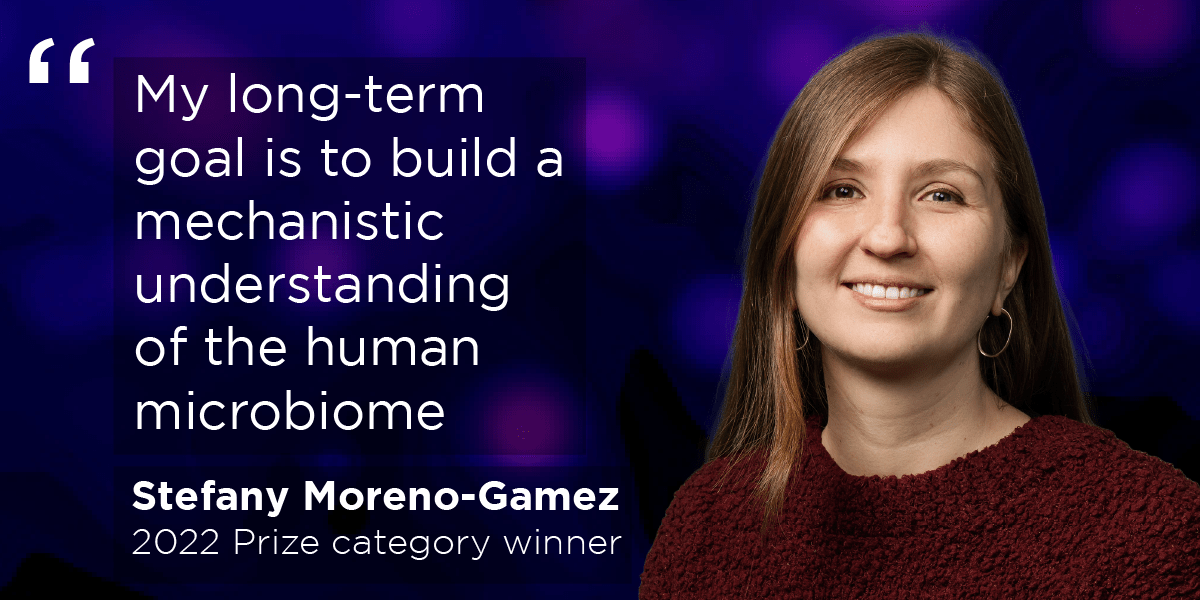 Photo of Prize winnre Stefany Moreno-Gamez with the quote "“My long-term goal is to build a mechanistic understanding of the human microbiome"