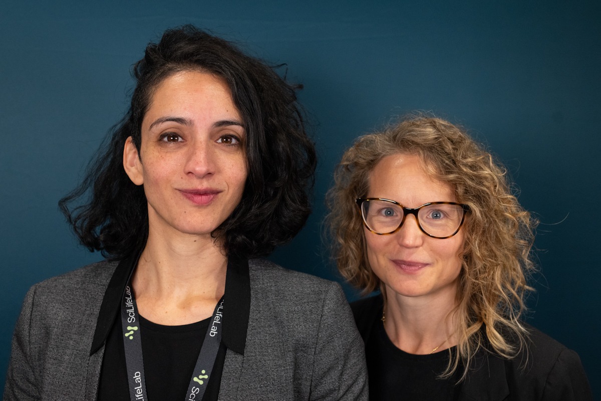 Site Coordinators Anabella Aguilera and Sophie Hellstrand in a close-up portrait, with a teal-colored background