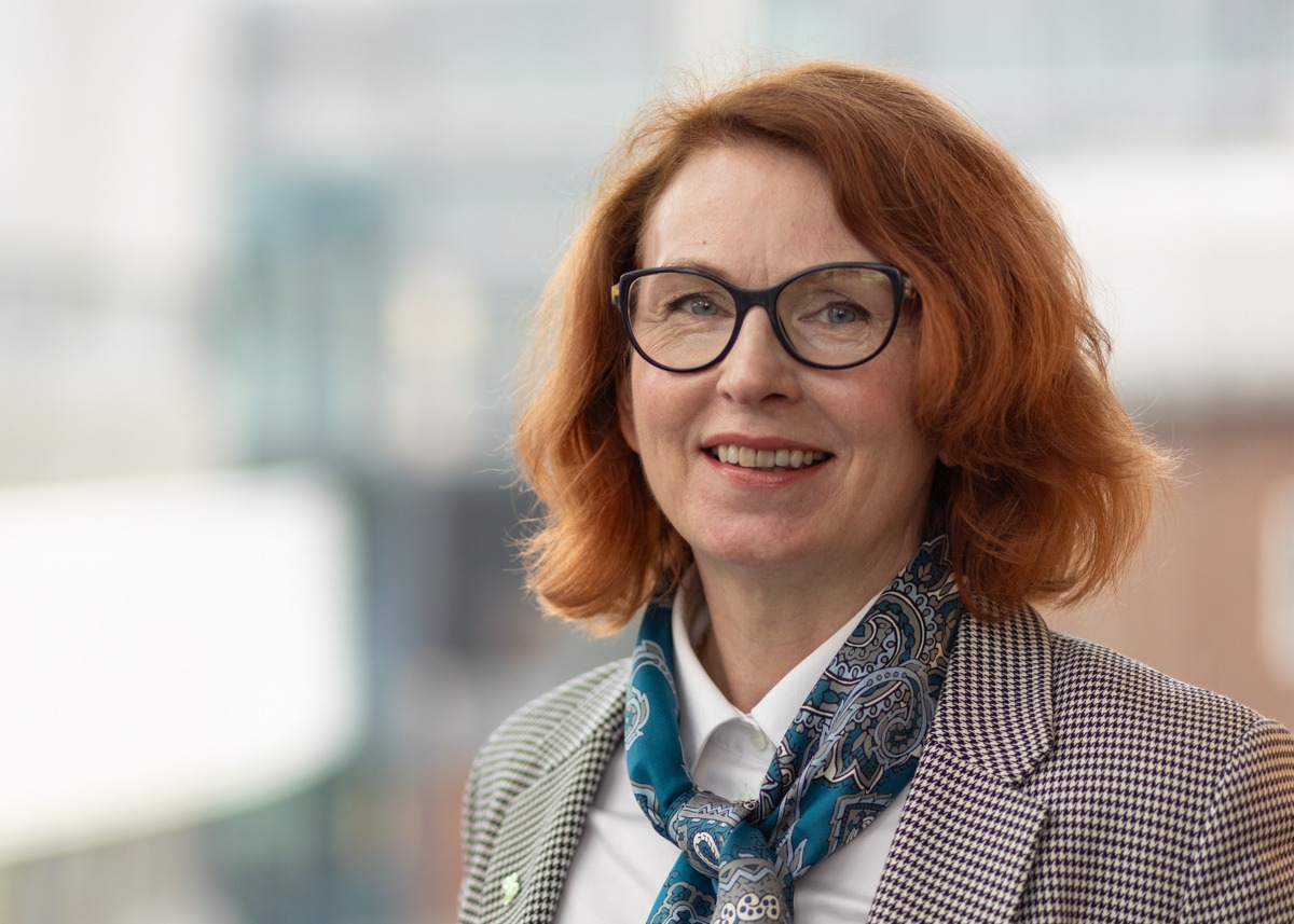 Carina Gustafsson with blurry SciLifeLab buildings in the background.